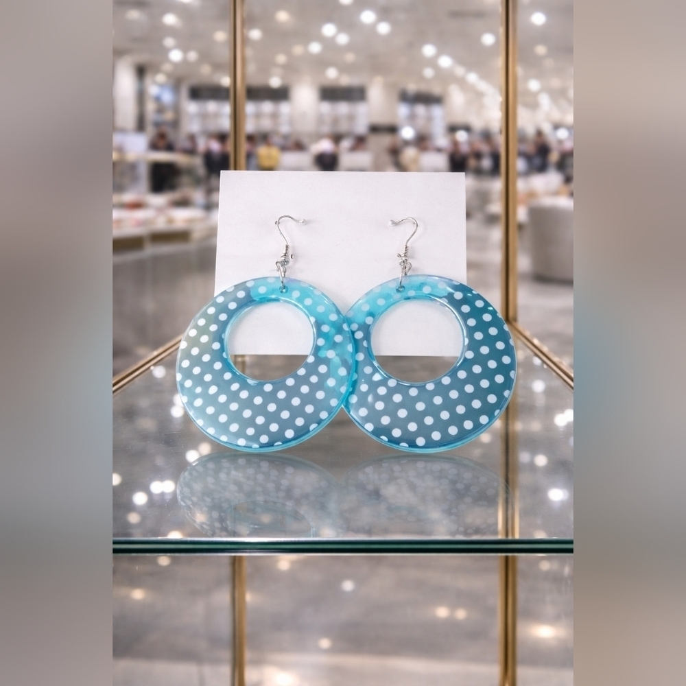 Blue Circle dangly earring with white polka-dots.
